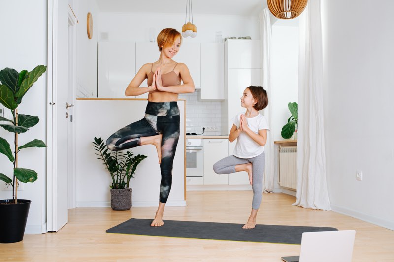 Mom and daughter tree pose